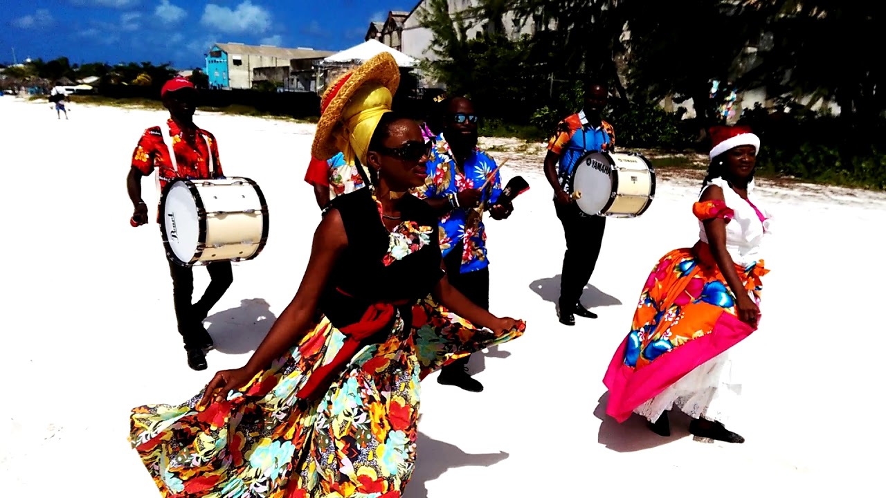 TUK ON THE BEACH WITH TOURISTS IN BARBADOS