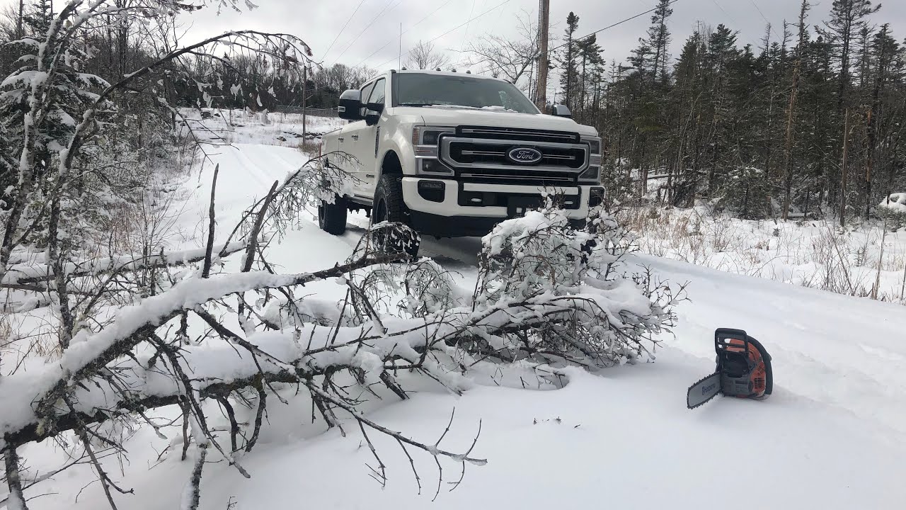 2020 SUPERDUTY CLIMBING A MOUNTAIN COVERED IN SNOW & CLEARING DOWNED TREES FROM ACCESS ROAD