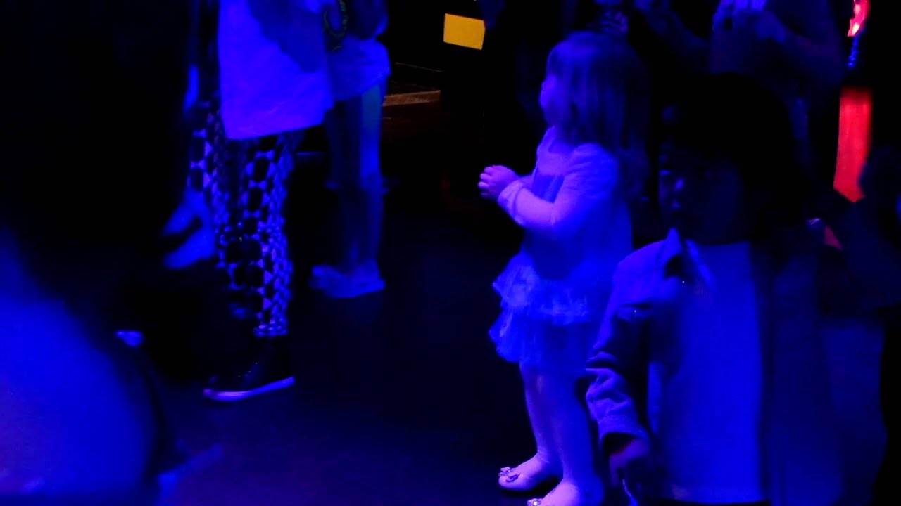 A boy dances with Cadence during the Chicken Dance