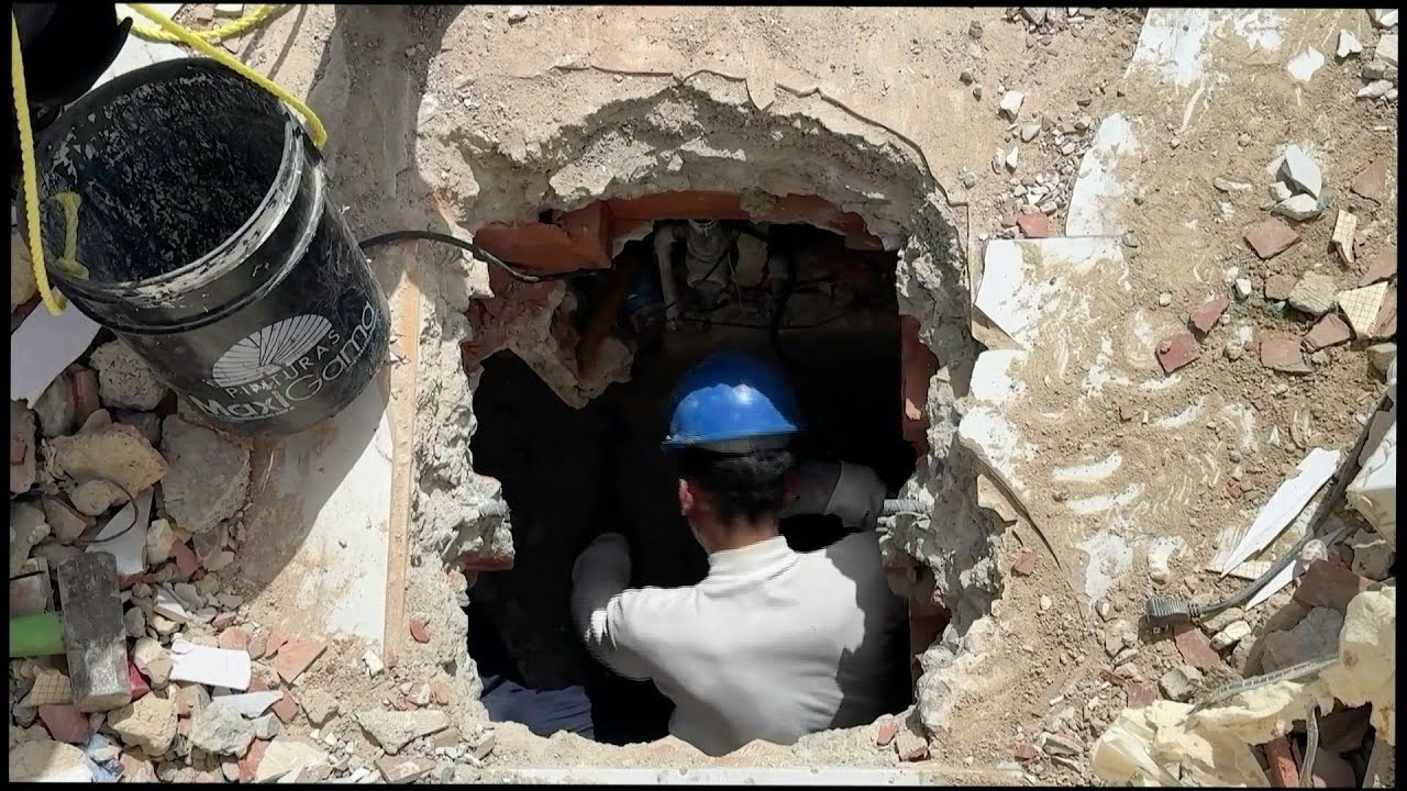 Search and rescue teams look for trapped people in the rubble of buildings | AFP