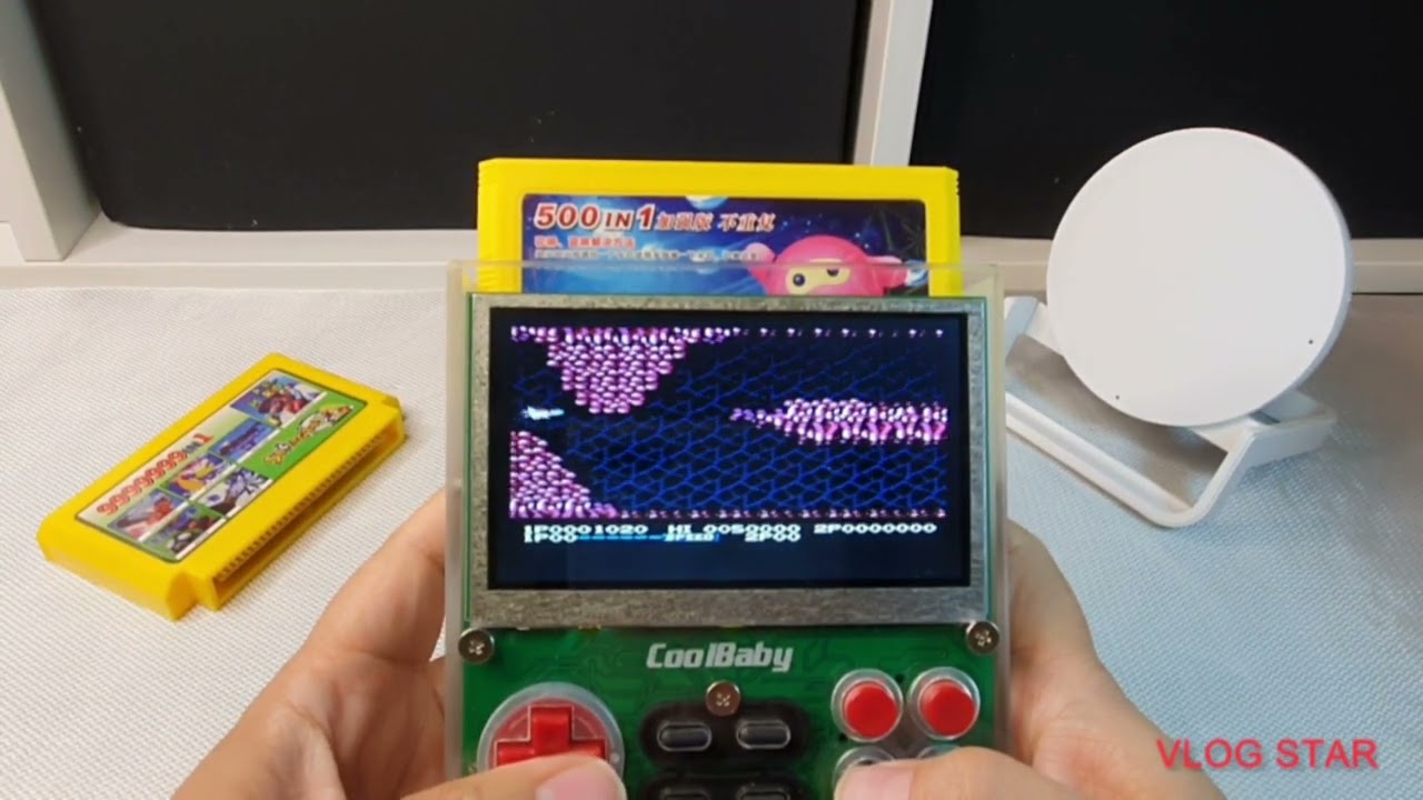Playing Cool Baby portable FAMICOM game system