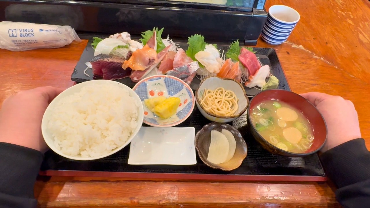 A Japanese nurse eating sashimi set meal for lunch