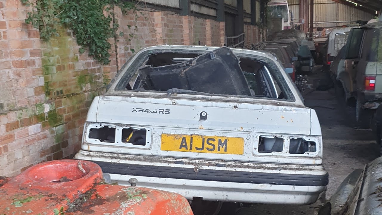 Blackpool fire trucks  and old cars lay abandoned In old farm For many years
