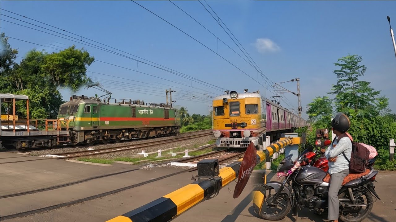 Monster WAG9 hauling long petrol loaded BTPN & EMU crosses like bullet between a busy railgate