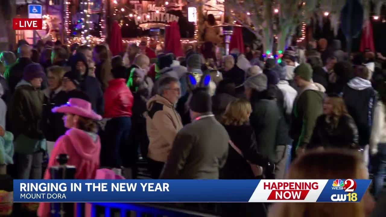 People celebrate New Year's Eve in downtown Mount Dora