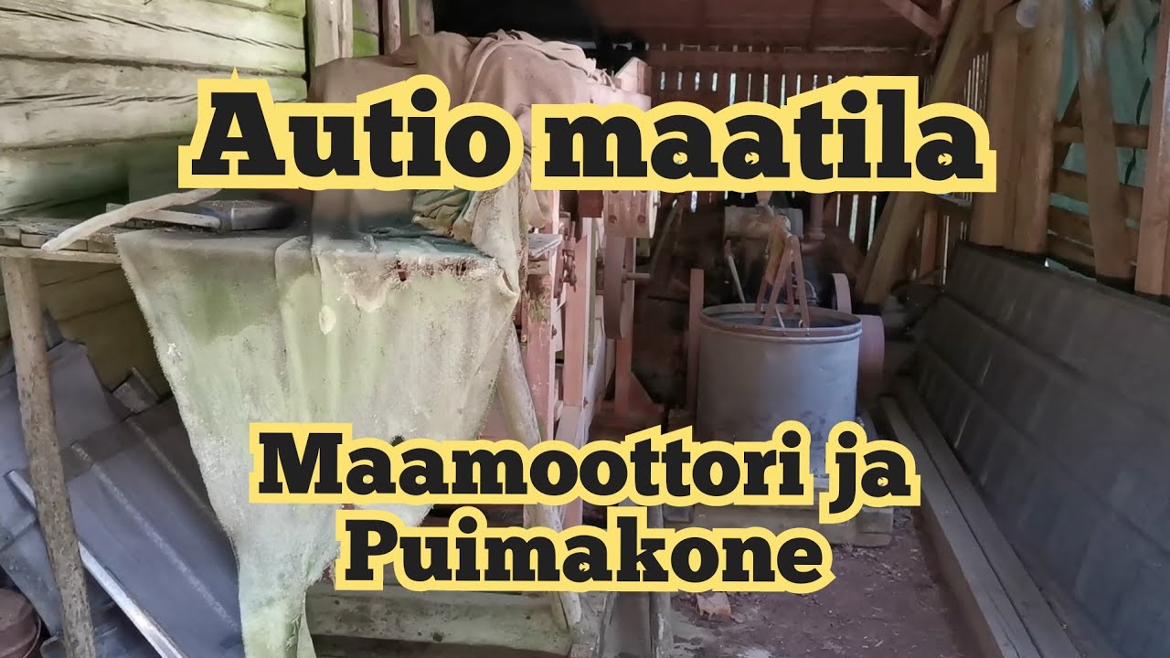 Vanha puimakone sekä maamoottori autio maatilalla