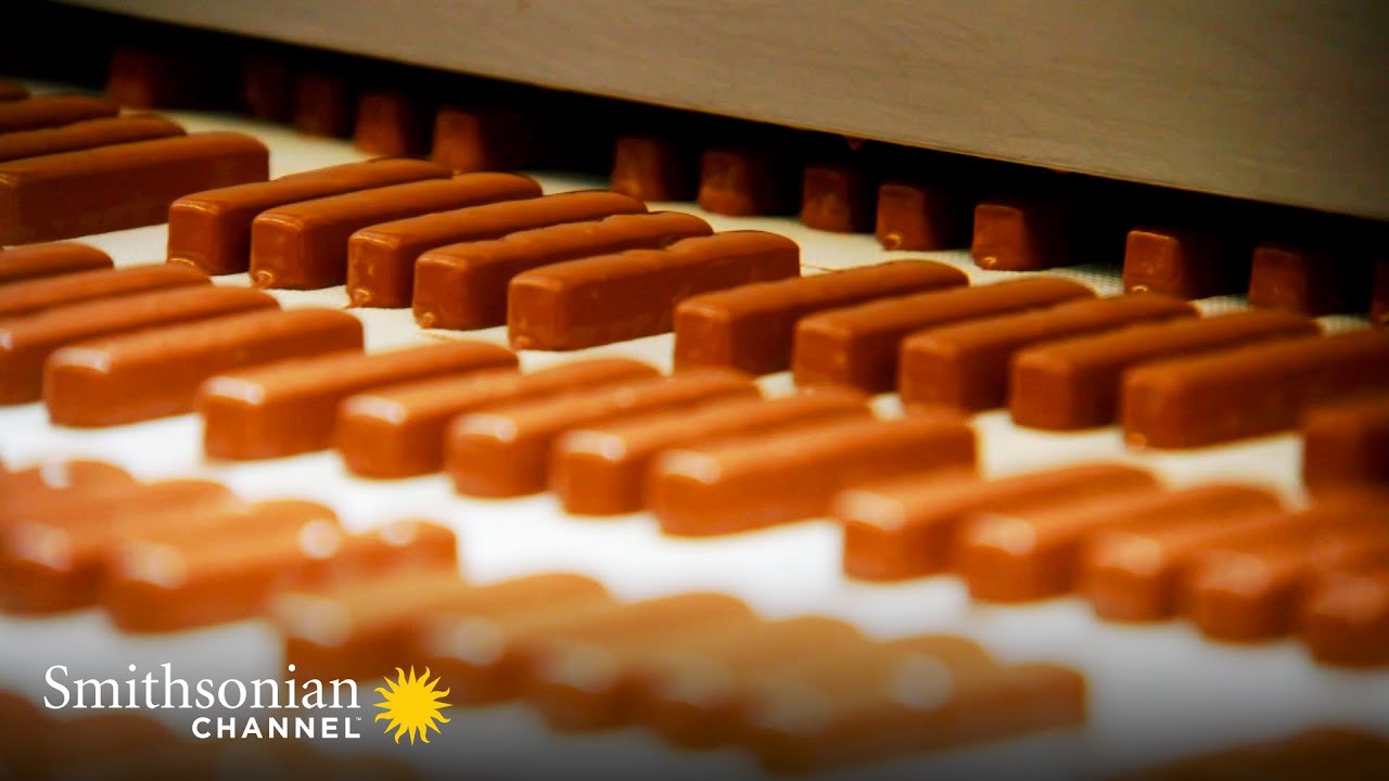 Revealed: How They Get Chocolate to Cling Perfectly to a Toffee Finger 🍫 Smithsonian Channel