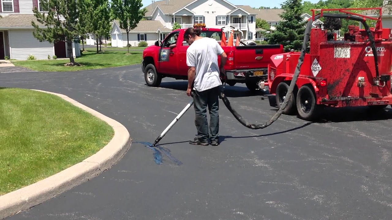 Eco Seal LLC. Crack filling Oakmonte Apartments with a Crafco