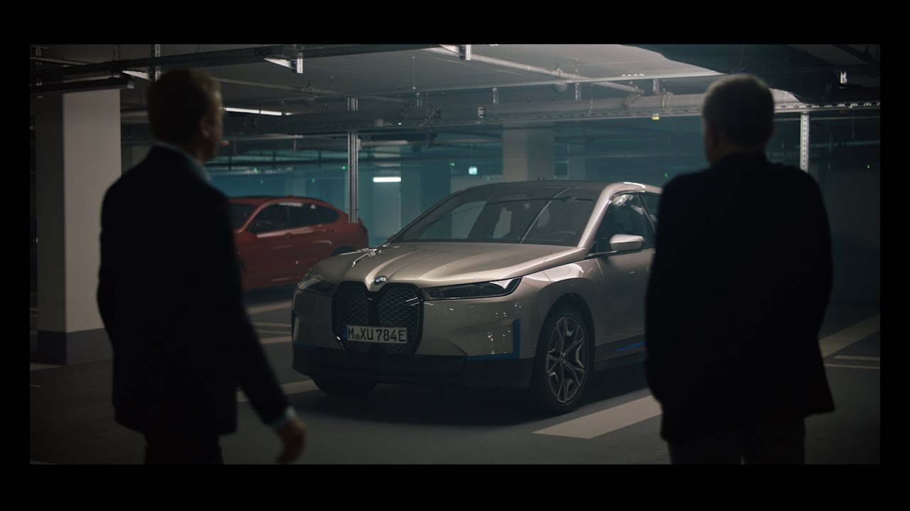 Christoph Waltz and Oliver Zipse test drive the BMW iX.