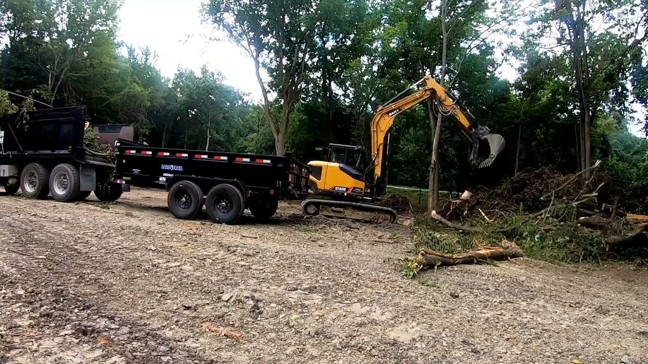 Hauling brush with the dump truck! #freighliner #sany sy80u