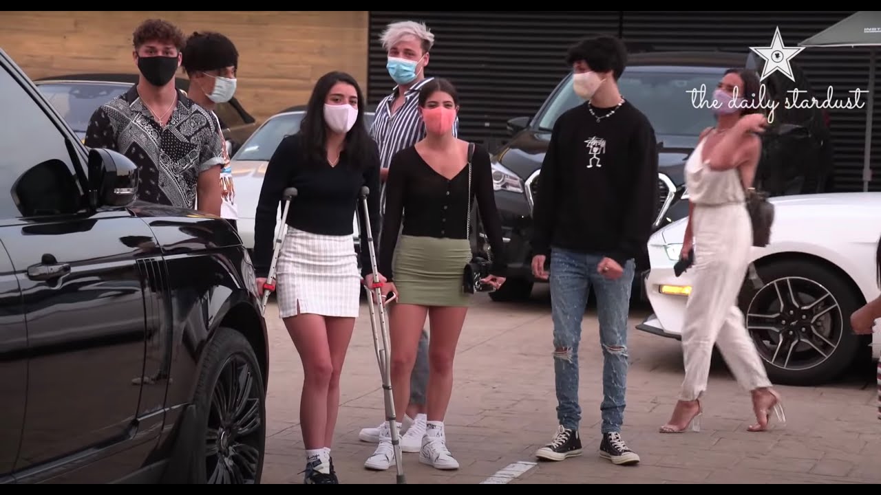 Dixie D'Amelio walks in crutches with Noah Beck after foot injury and talks Addison Rae boxing match