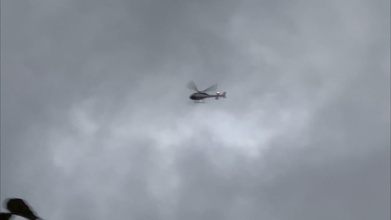 Private Aerospatiale AS355 [G-IALC] flying overhead during evening