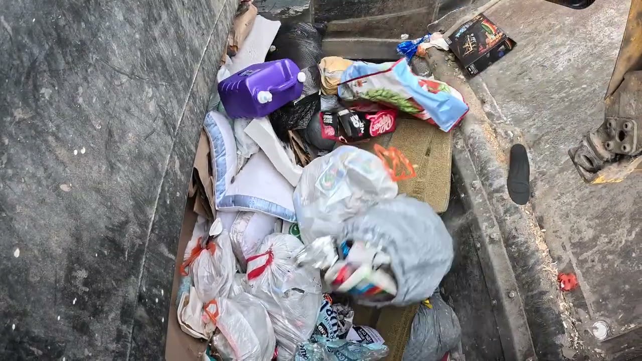 Garbage truck hopper POV: McNeilus ZR on Thursday trash