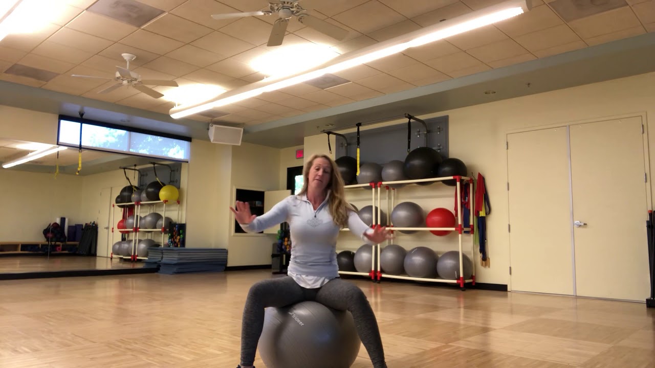 Exercises sitting on the exercise ball