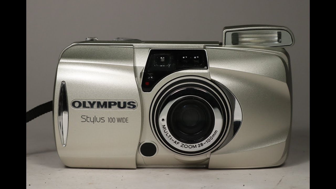 Olympus Stylus 100 Wide 35mm film camera being checked over