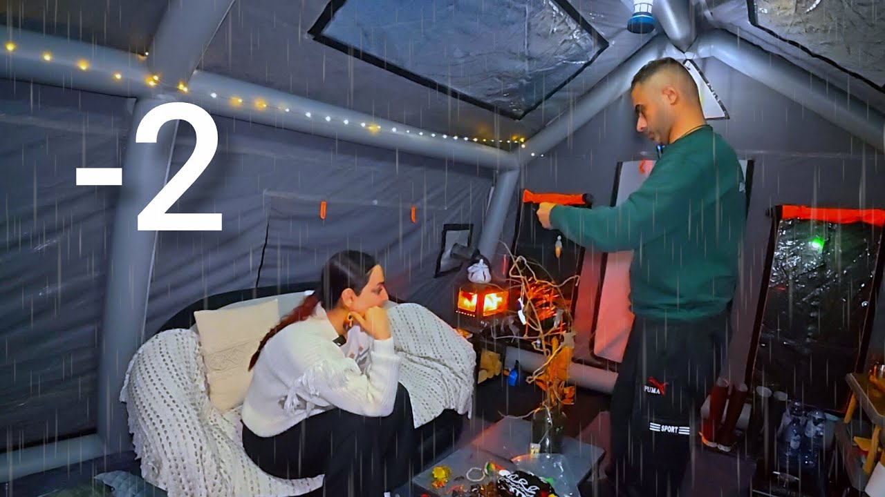 Camping in heavy rain  کەمپکردن لە باران و سەرمایەکی زۆردا and cold with a large inflatable tent