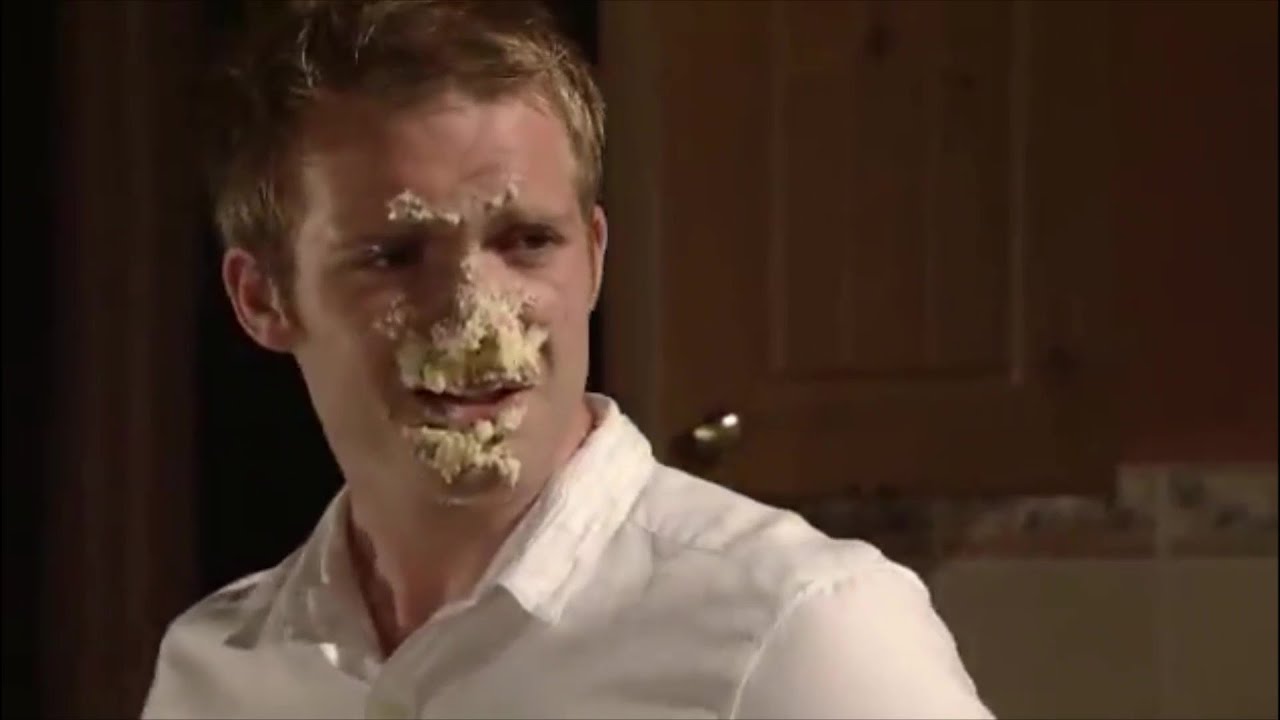 Chris Fountain gets a cake in the face