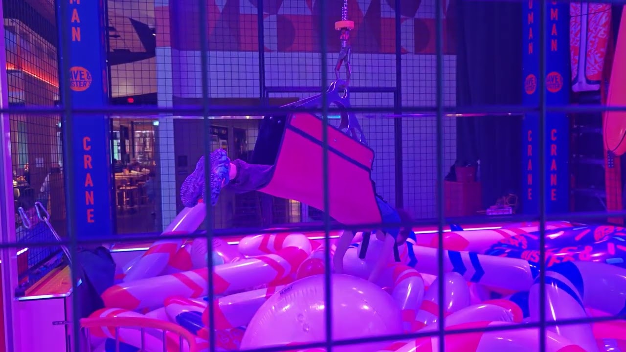 Dave & Buster's human claw machine