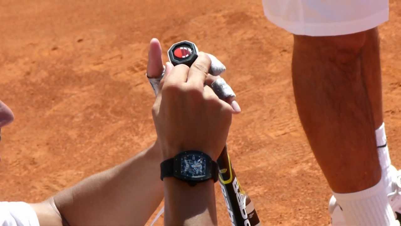 Rafa Re-Taping His Racquet