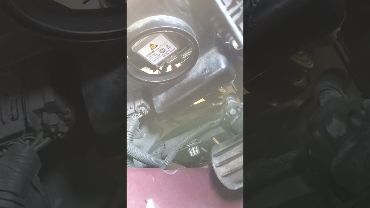 Installing a 2009 Lincoln MKS headlight bulb without removing the bumper