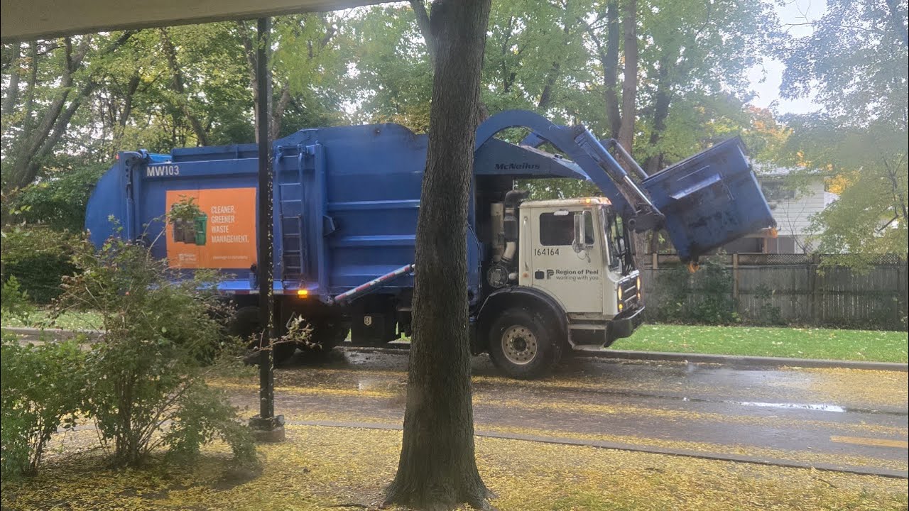 Recycling Truck Handling Recycling Bins In The Rain