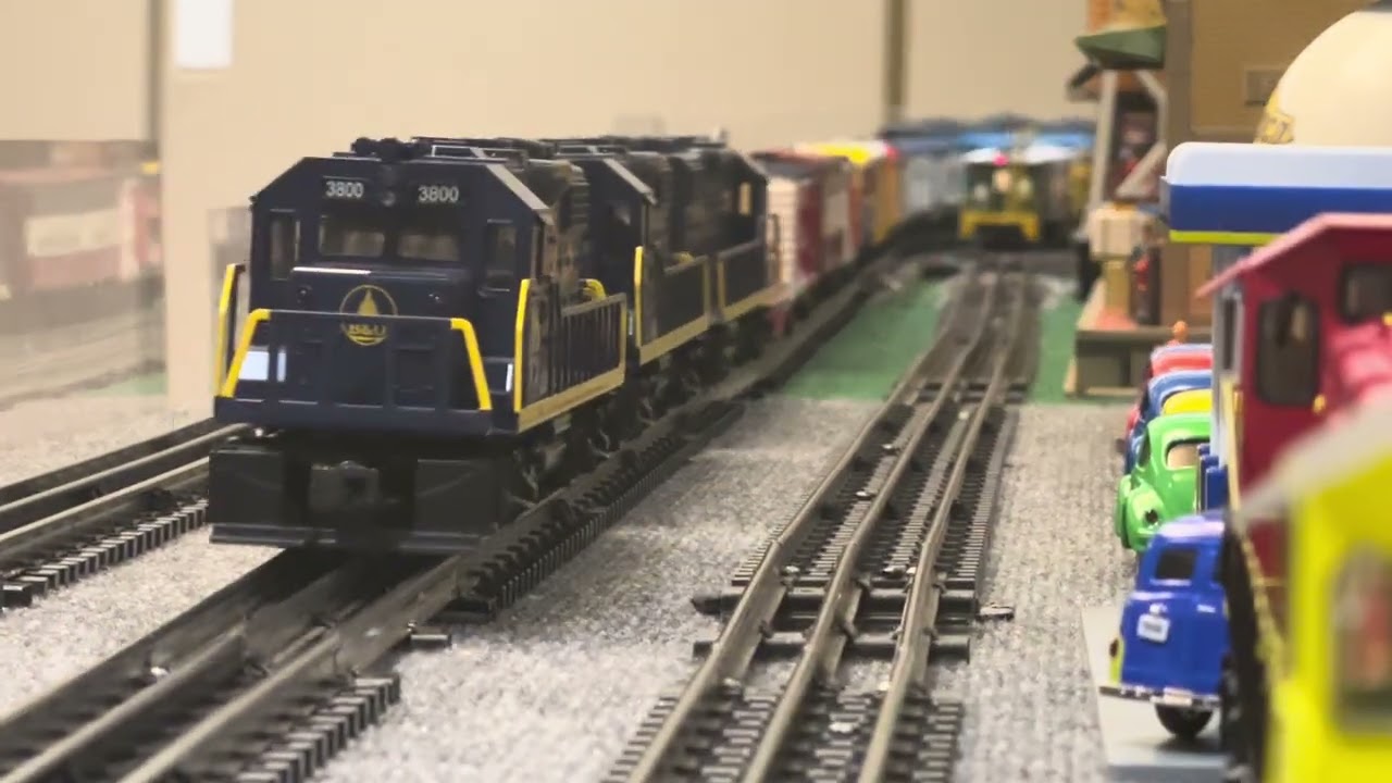 Two CSX Spirit of Armed Forces Locomotives charge down the tracks with their freight consist.