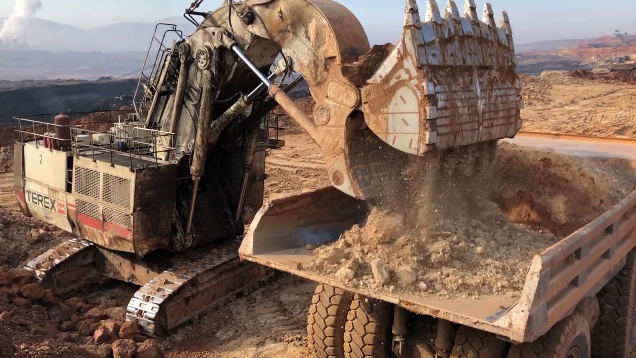 Terex RH170 Front Shovel Excavator Loading Hitachi EH3500 And Terex TR100 Dumpers