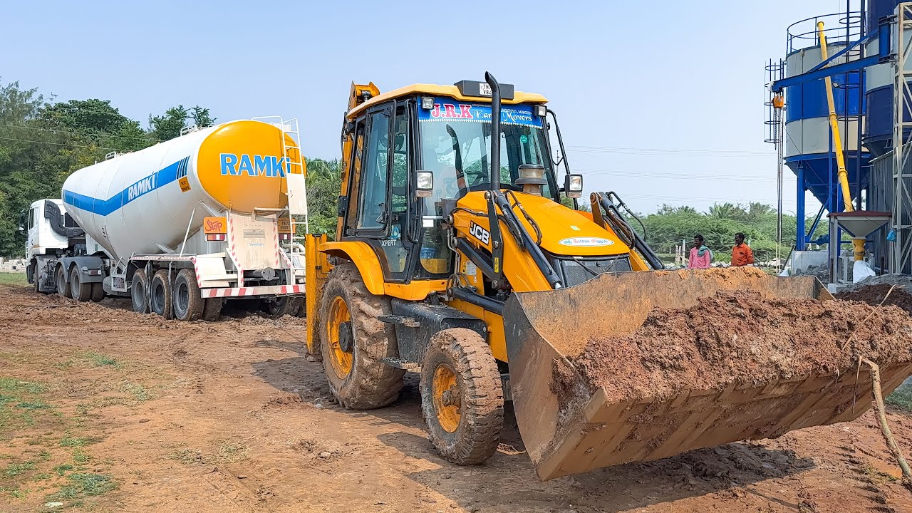 TATA Bulker Truck Stuck in Mud Rescue by JCB 3DX Plus pulls it precisely to cement discharge point
