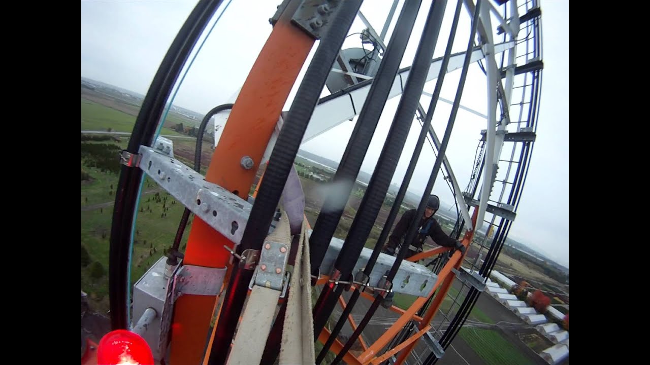 Relamping a DOL.MP4. Pacificrigger and crew working at extreme heights