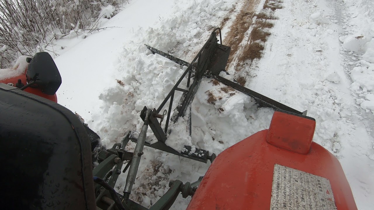 Yanmar YM2020D with rear snow blade and heavy wet snow 1