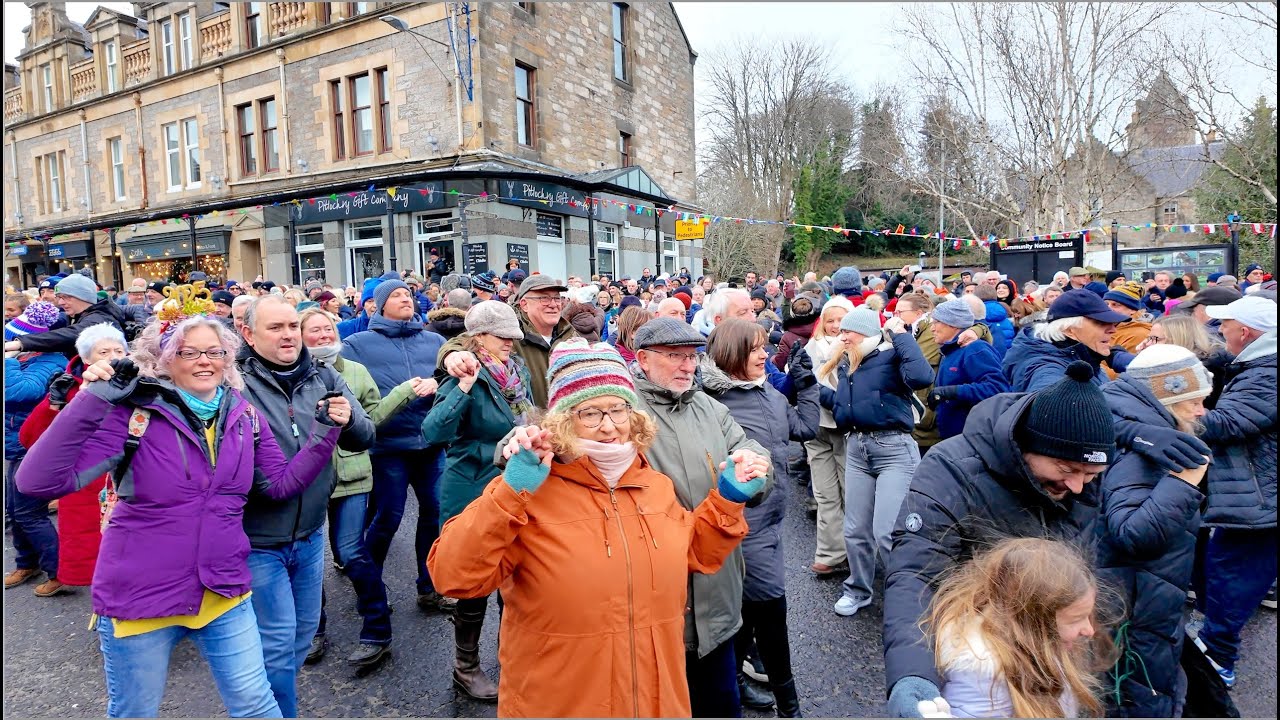 Public Ceilidh as crowds join in Gay Gordons dance during Pitlochry New Year 2025 Street Party