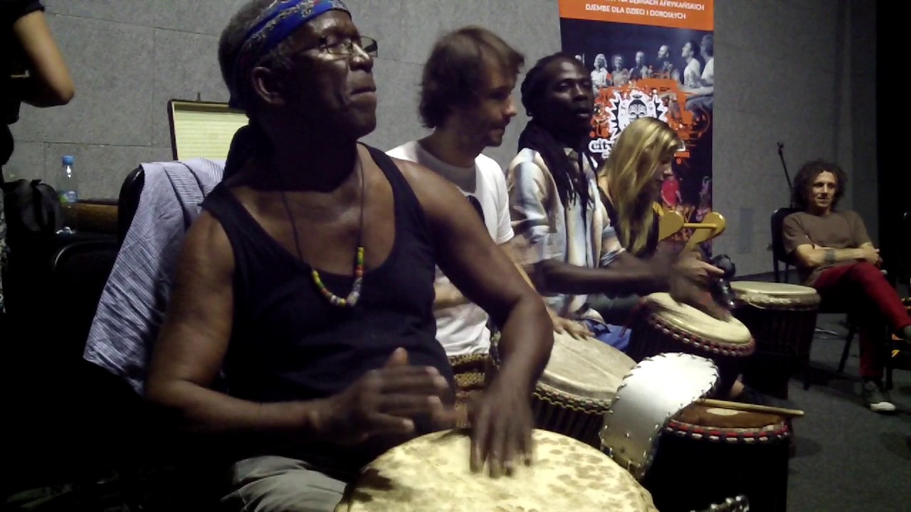 Famodou Konate preparing dunduns for dununba Koro workshops 2017 Poland