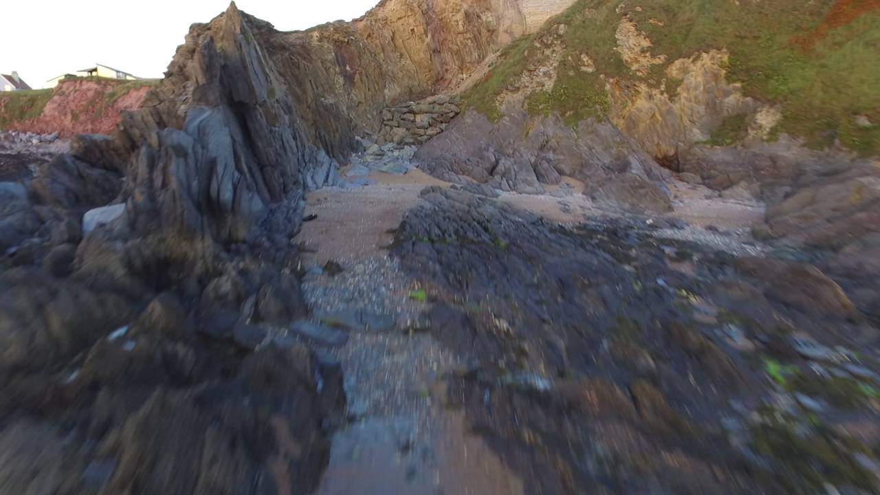 Summer evening at South Milton (Thurlestone) Sands: drone footage inc fly-through of the Thirl Stone