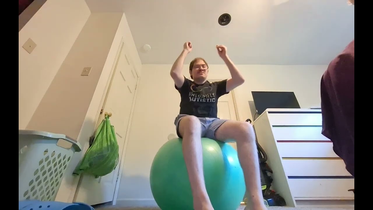 vestibular sensory stimming bouncing on the green exercise ball 