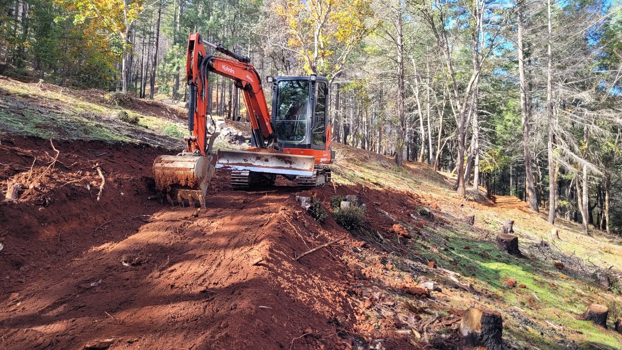 Steep hillside road repair and building with the Kubota KX 040 4