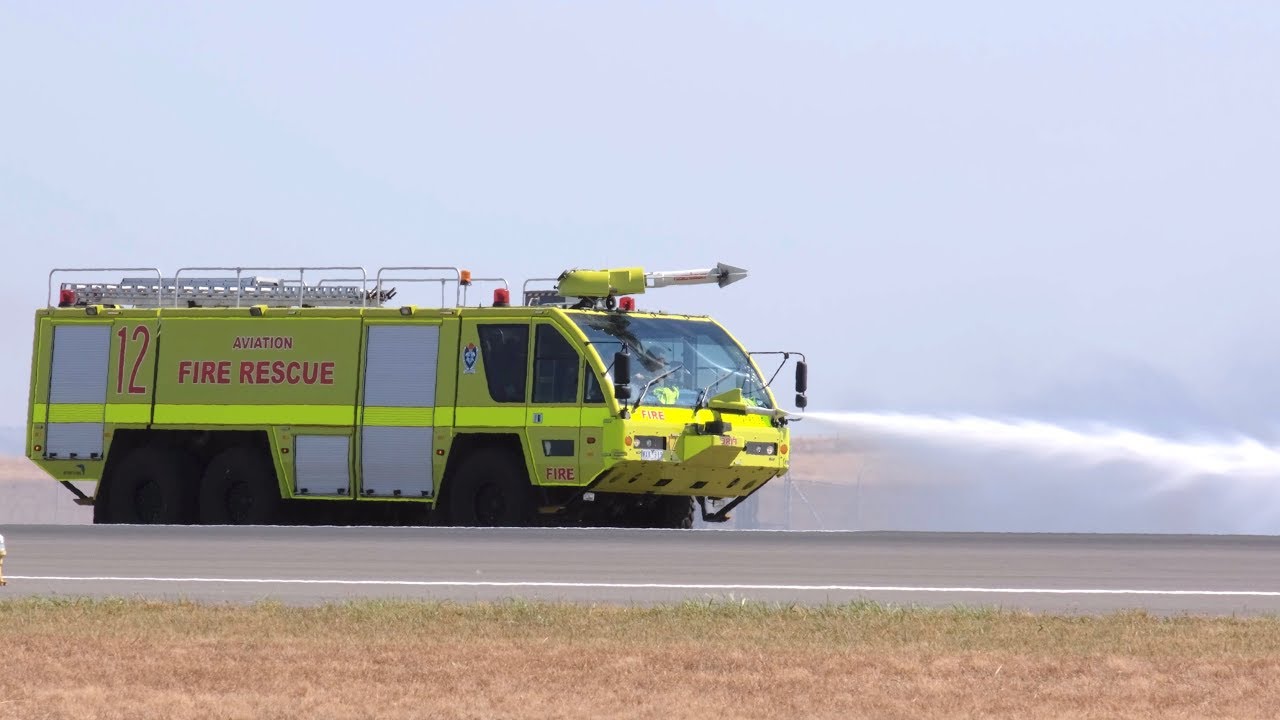 4K 2019 Avalon Airshow - Airport fire truck responding to a pyrotechnics display fire.