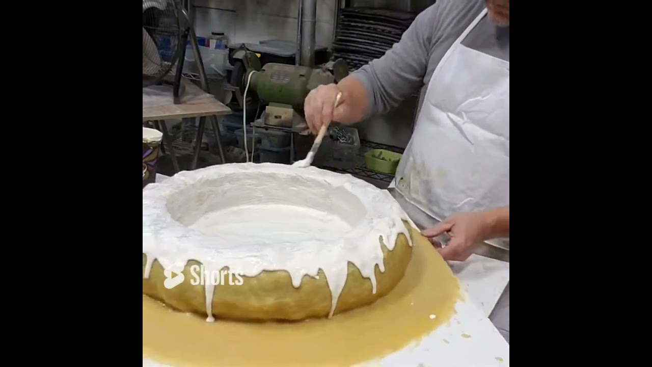 Quick coat of latex rubber on a bird bath mold.