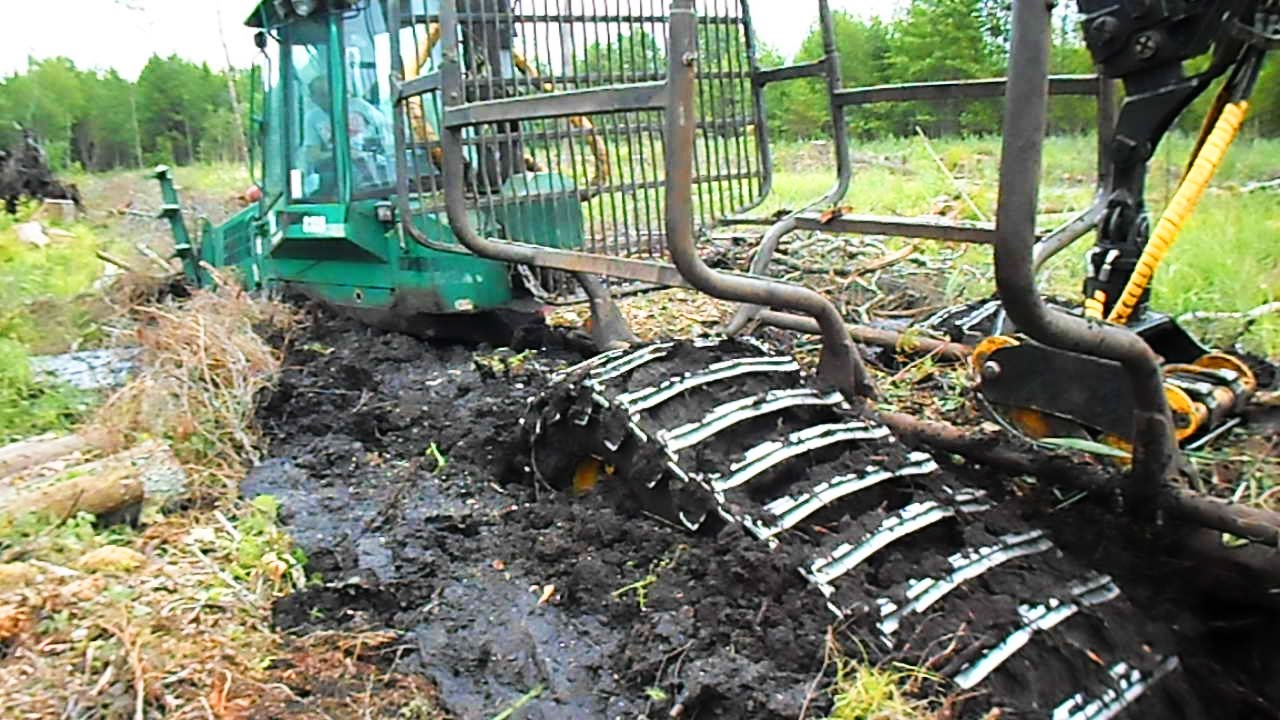 Loaded Timberjack 810B  stuck in mud, difficult logging conditions