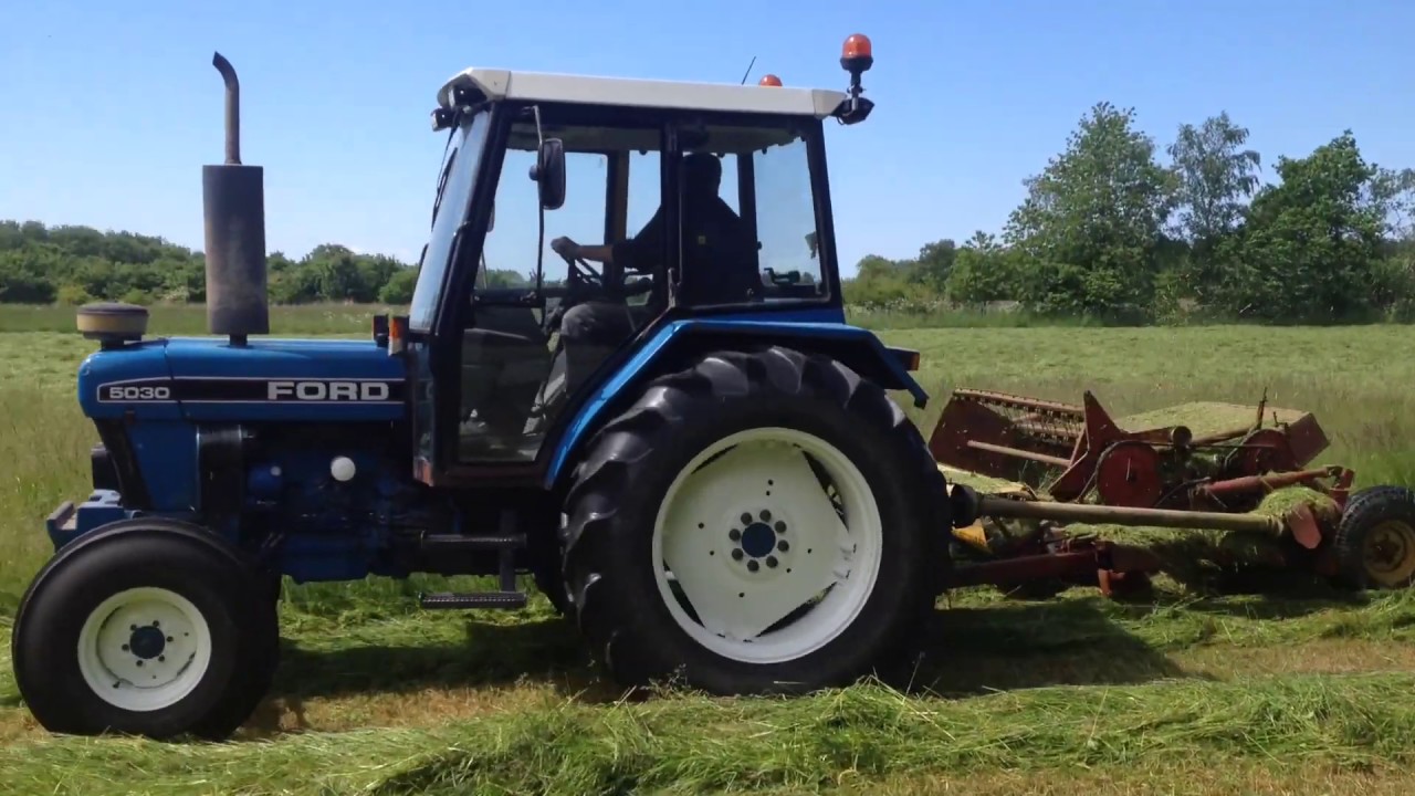 Ford tractors making hay
