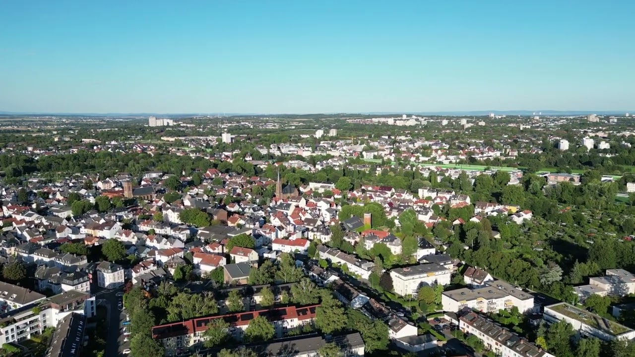 Drone flight over the Heddernheim distrikt in Frankfurt am Main on a sunny Afternoon.
