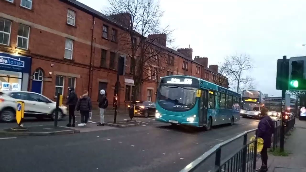 Arriva Sapphire 575 and Stagecoach 8 passing Wigan College