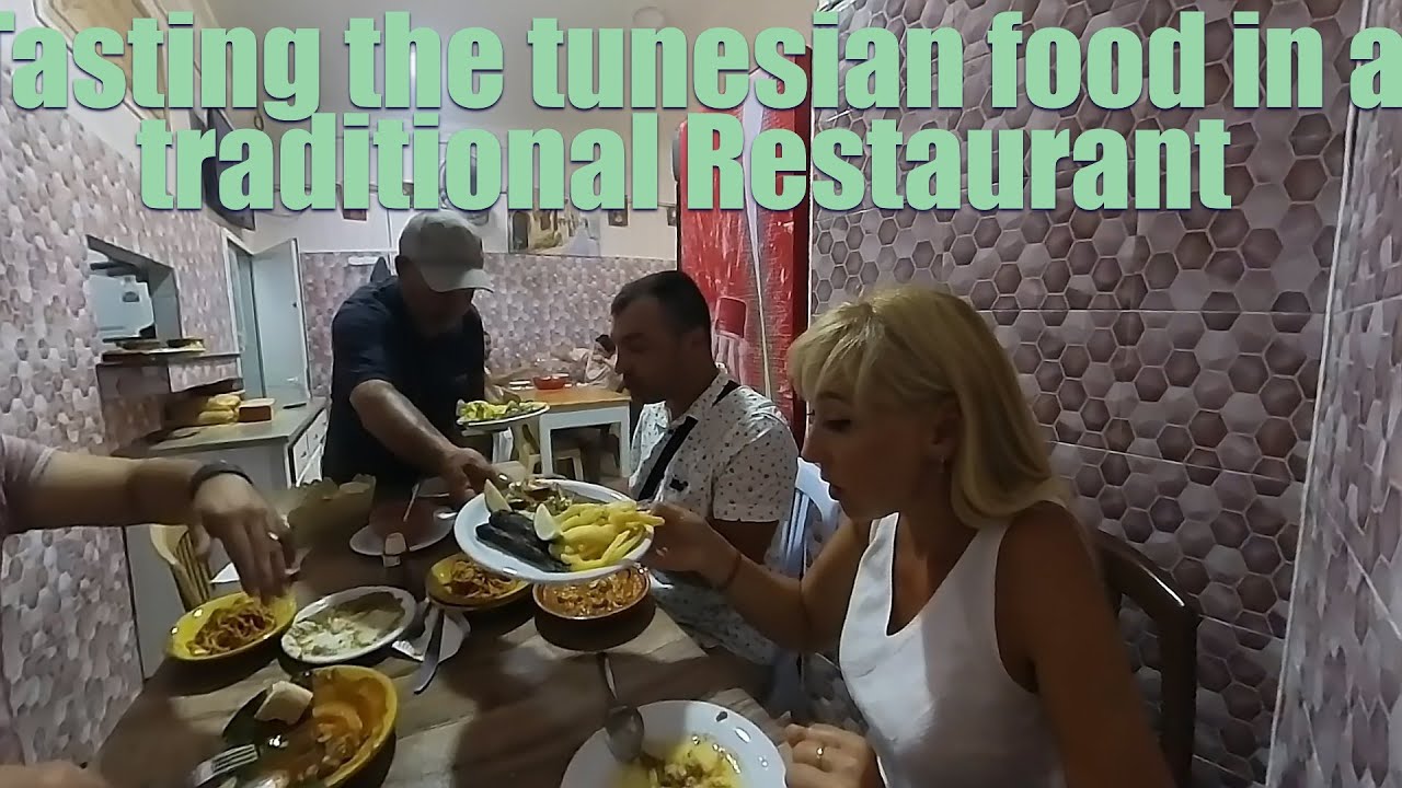 Tasting the Tunesian Food in a traditional restaurant. 