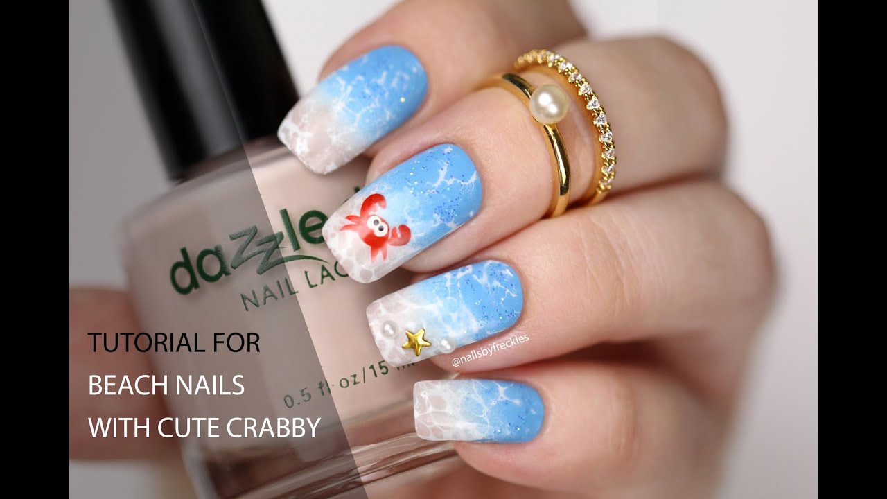 Ombre beach nails with watermarble splashes and crabby