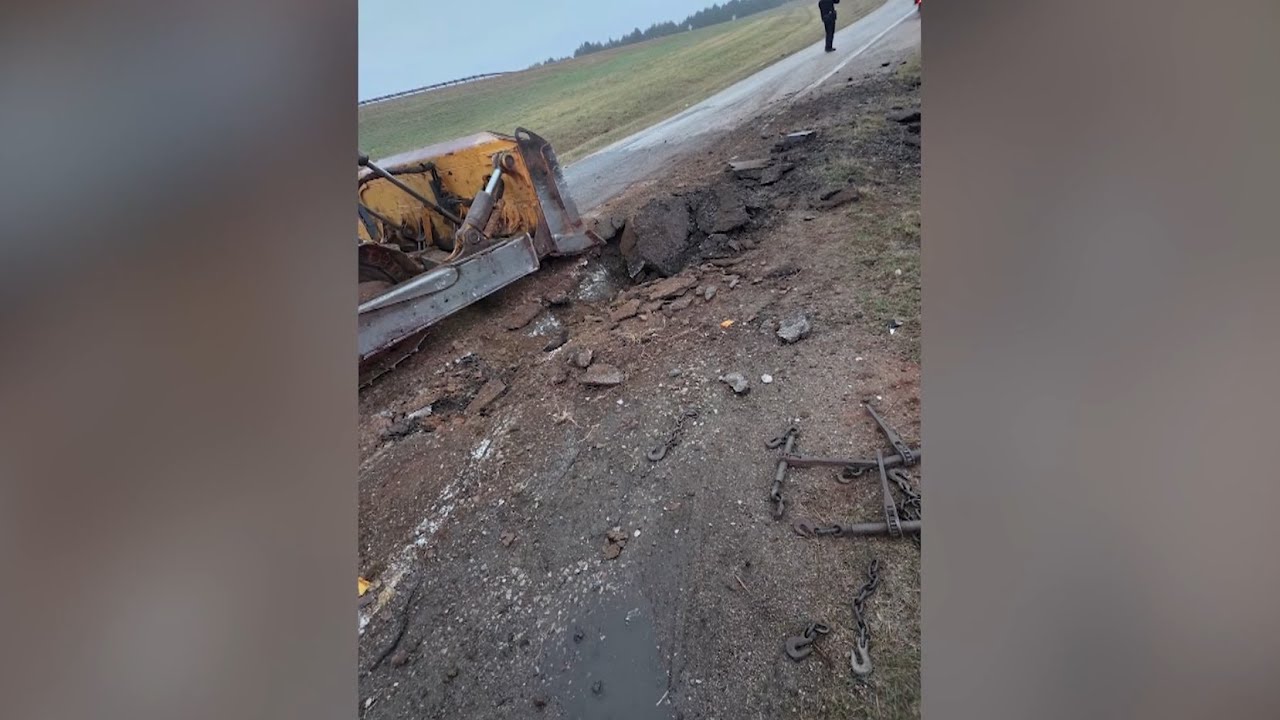 Bulldozer falls from semitruck, causing damage on Tecumseh highway