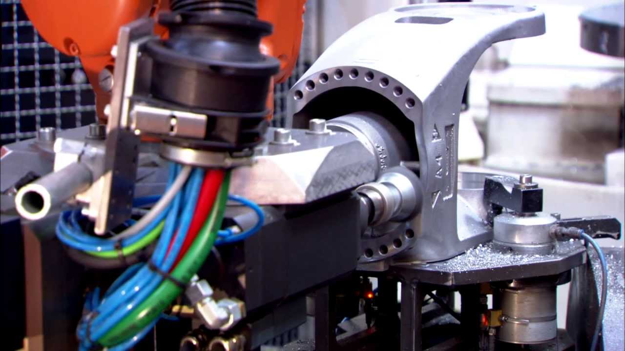 KR QUANTEC loading and unloading a machine tool