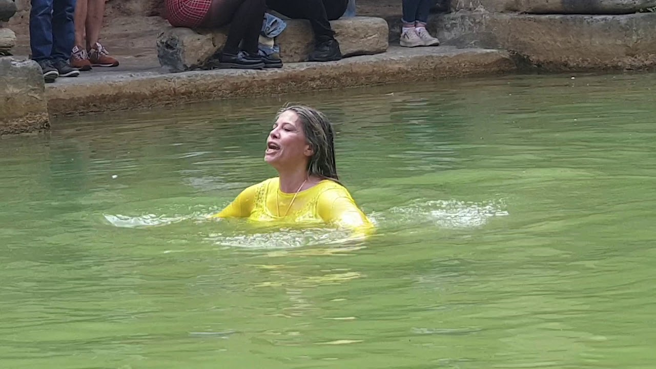 Woman jumps into Roman Bath for blessings