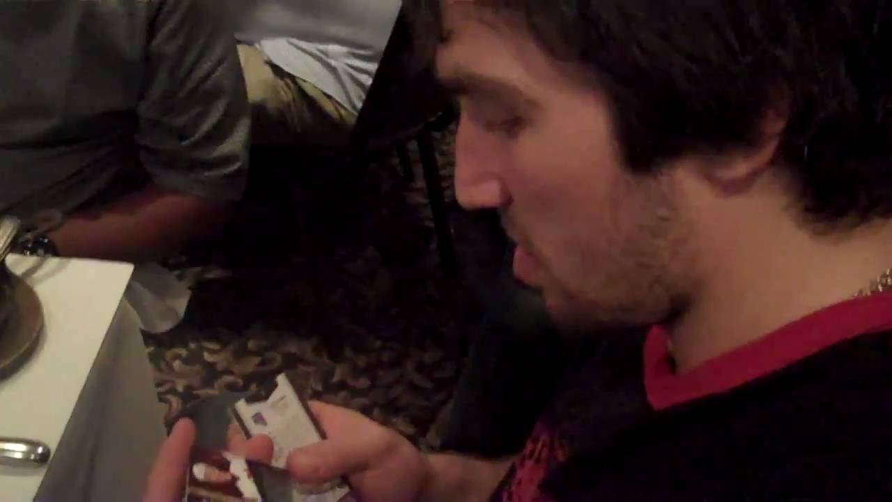 Alexander Ovechkin pulls a Bobby Orr autograph from an Upper Deck pack