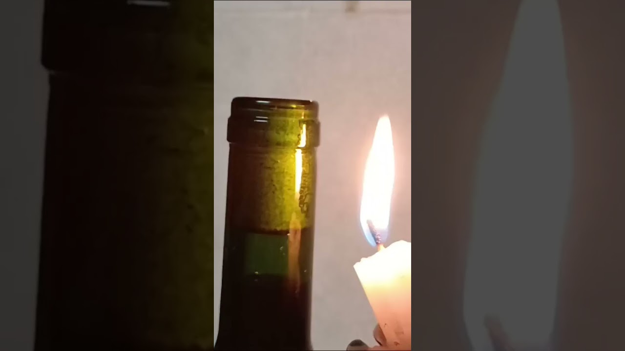 How to open a wine bottle without a corkscrew, candle edition #wine #winebottle #hacks #easyhometips