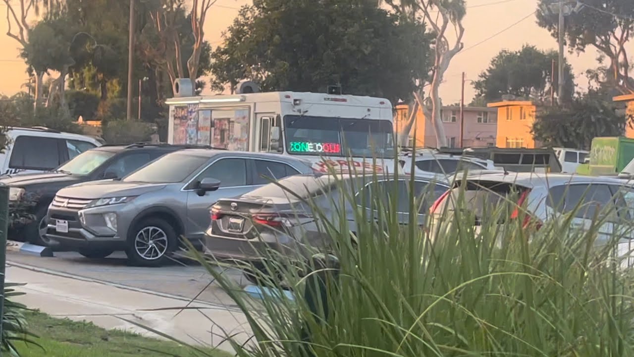White soft serve ice cream truck is here again playing entertainer with hello