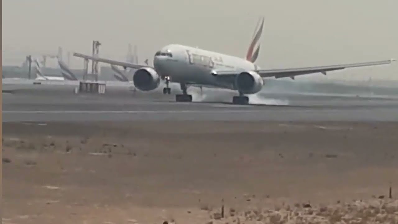 Smoke coming out from tires of Emirate fight while landing.